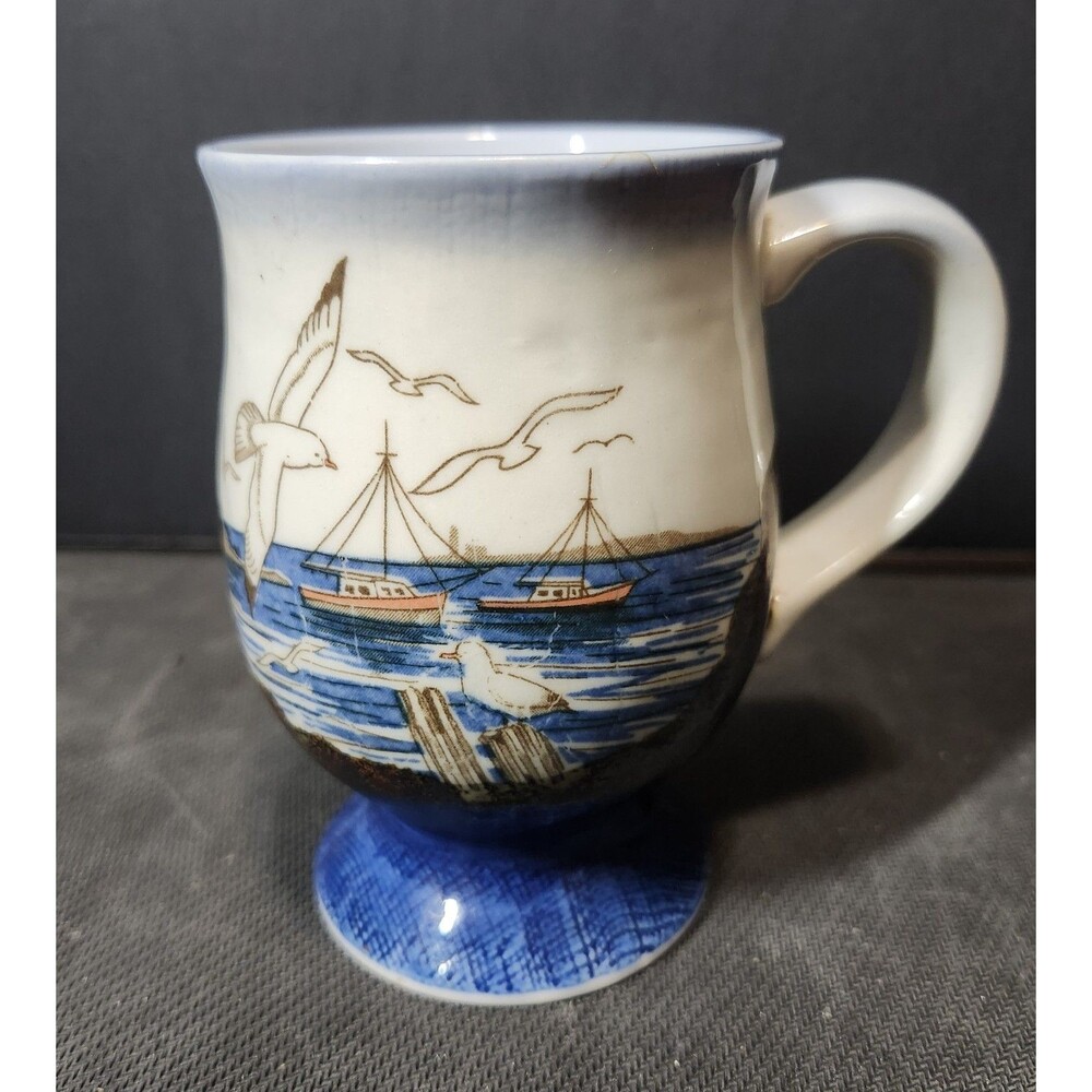 This is a vintage Otagiri stoneware pedestal coffee mug.